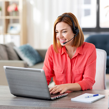 Remote worker with laptop and headset