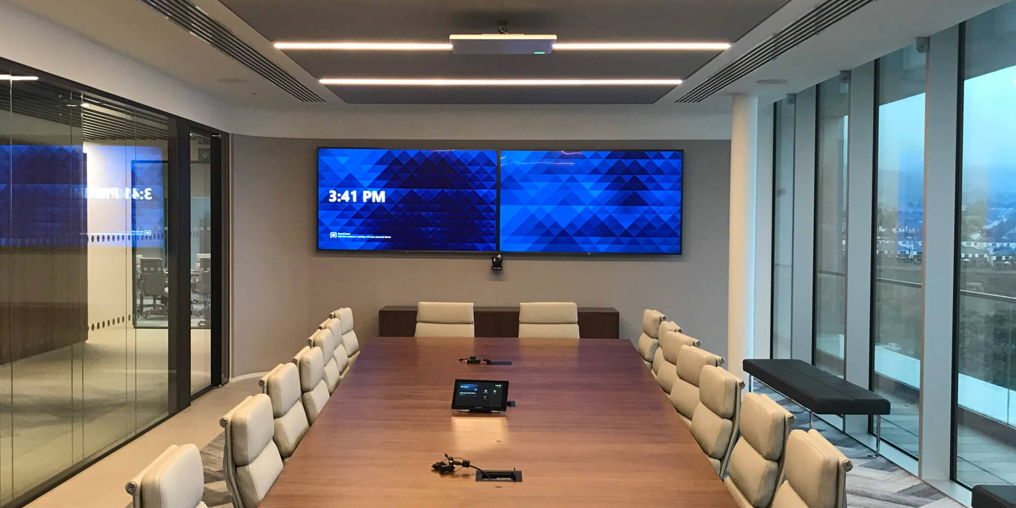Boardroom with two large AV displays